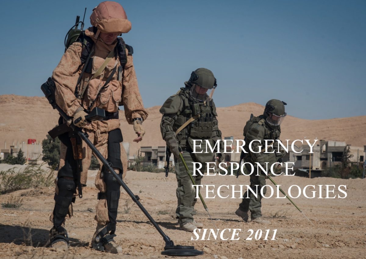 Emeretech deminers sweeping a minefield with metal detectors